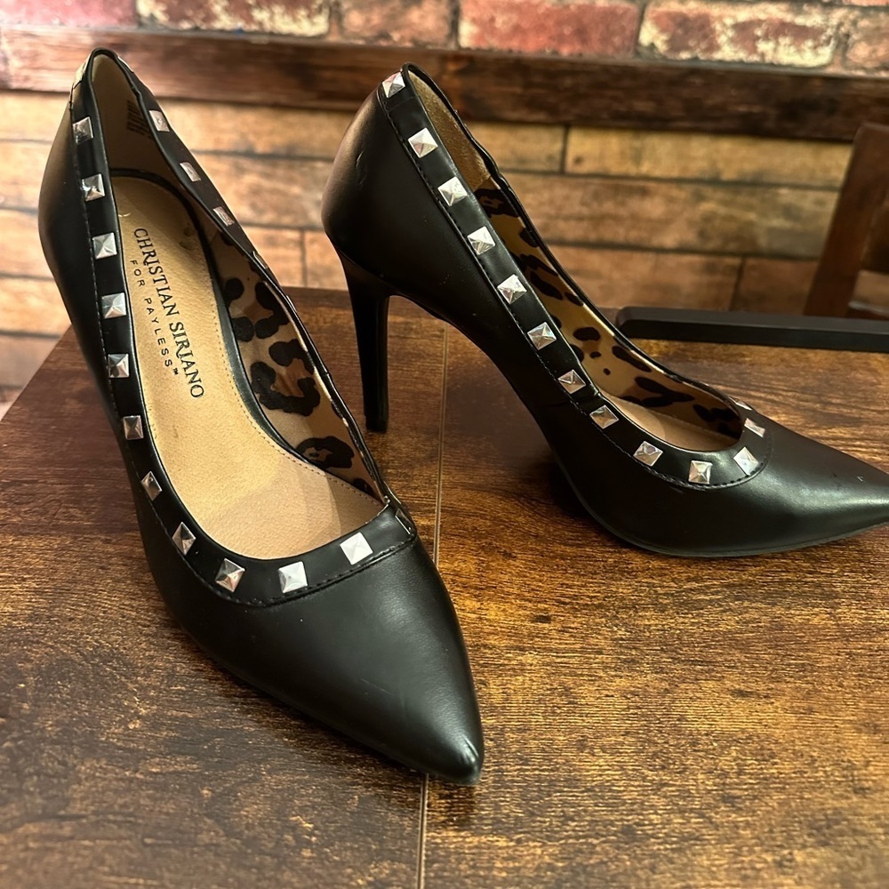 Christian Siriano size 6 black heel with silver studded detail.